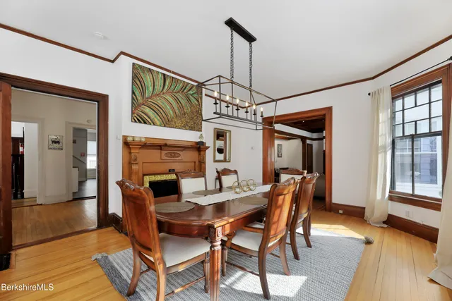 a dining room with furniture and window