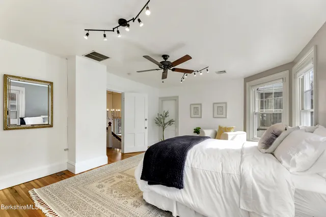 a bedroom with a bed and window