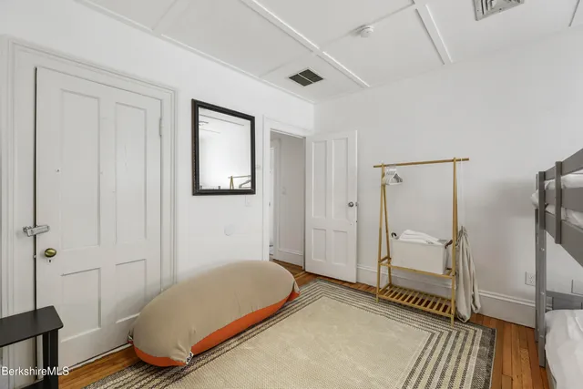 a bedroom with a bed and a table