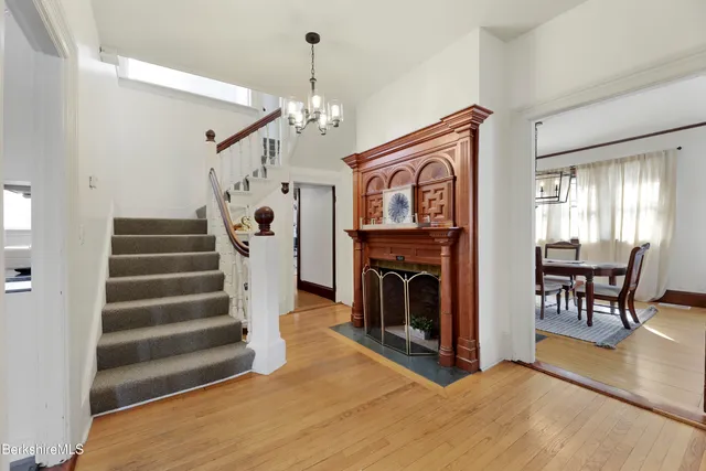 a view of a livingroom with furniture and a chandelier