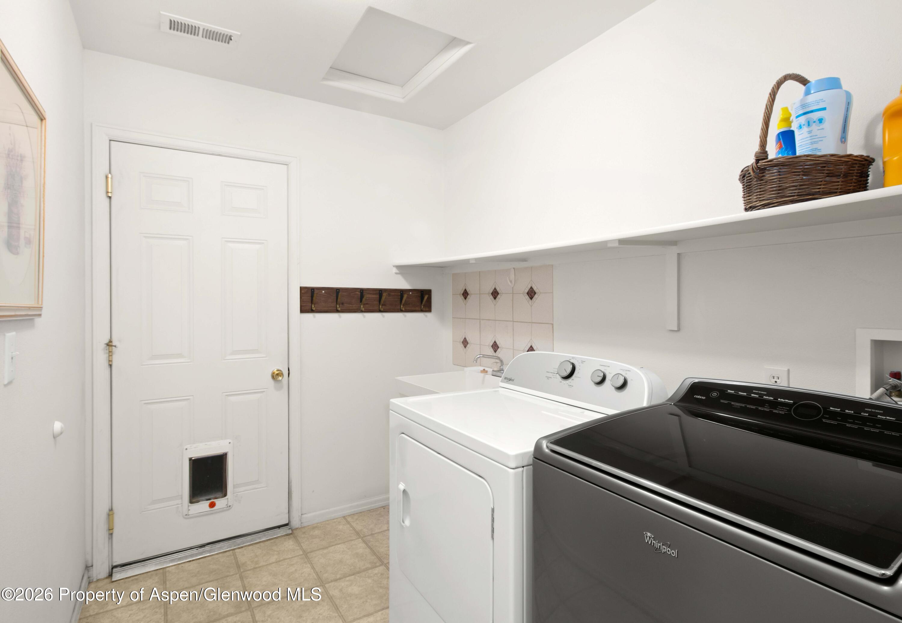 256 Cliff View Circle Parachute, CO 81635 - Photo 13 of 20 a utility room with dryer and washer