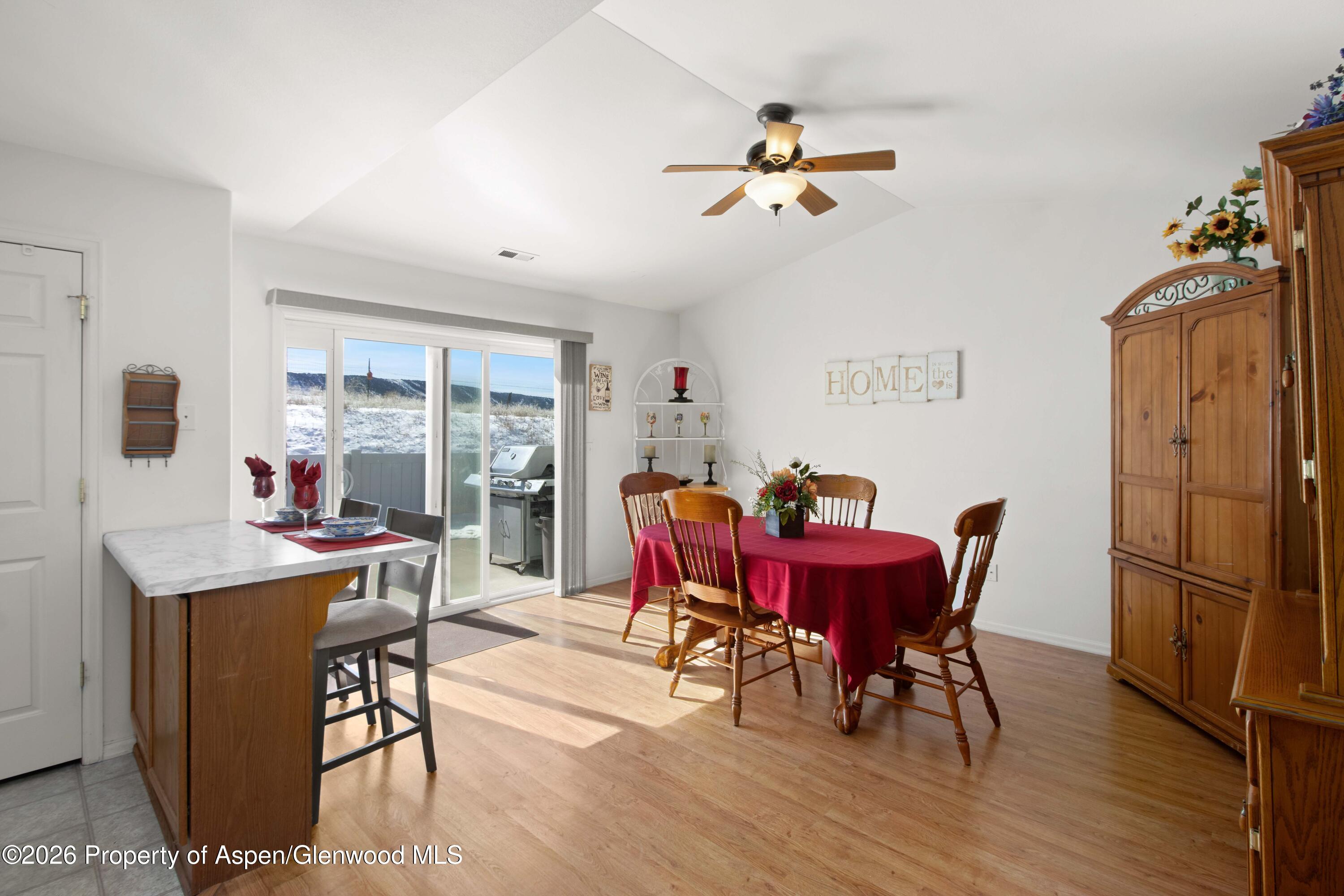 256 Cliff View Circle Parachute, CO 81635 - Photo 4 of 20 a view of a dining room with furniture window and wooden floor
