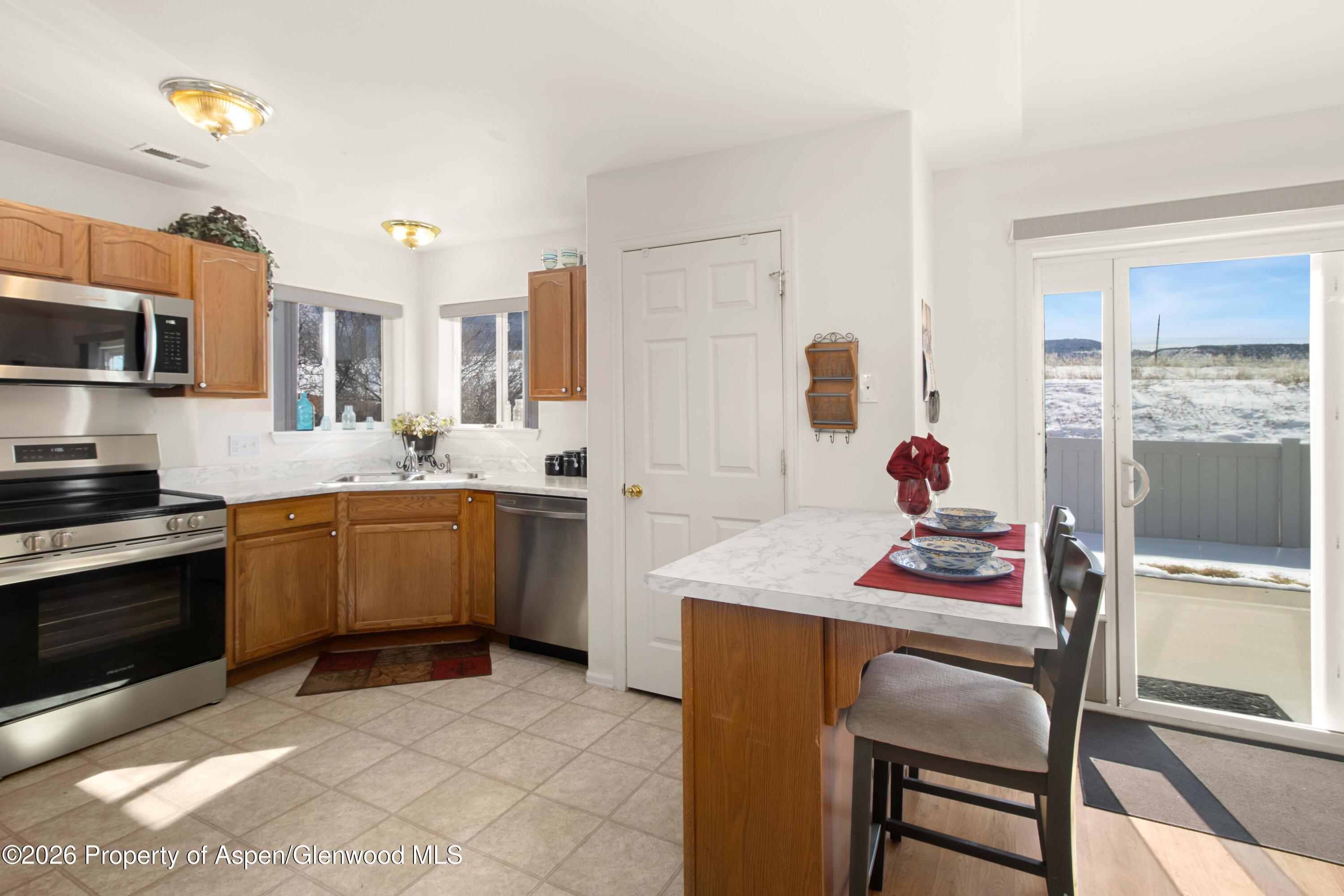 256 Cliff View Circle Parachute, CO 81635 - Photo 5 of 20 a kitchen with a sink appliances and cabinets