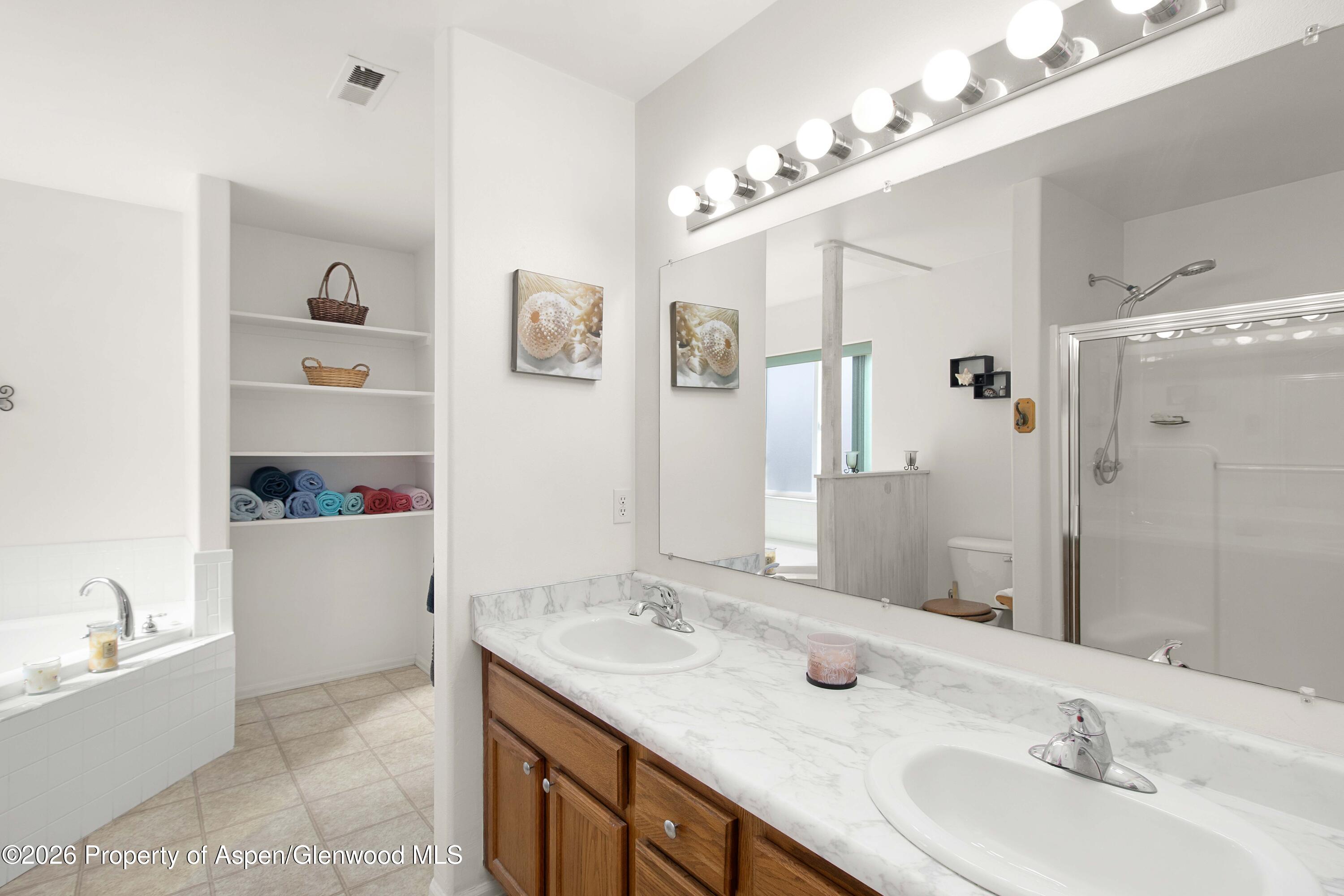 256 Cliff View Circle Parachute, CO 81635 - Photo 10 of 20 a bathroom with a granite countertop sink and a mirror