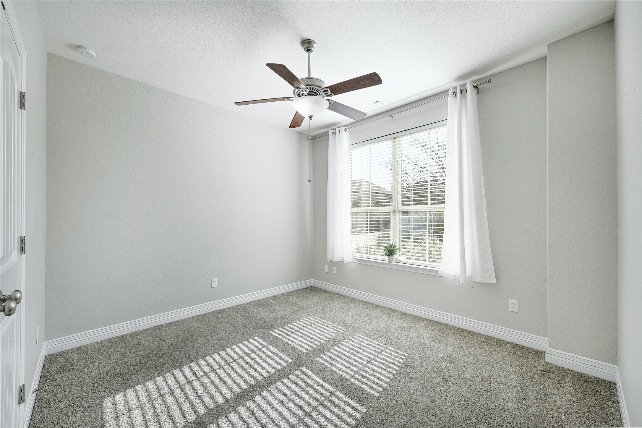 18512 Tanner Bayou Loop Austin, TX 78738 - Photo 14 of 32 a view of an empty room with a window