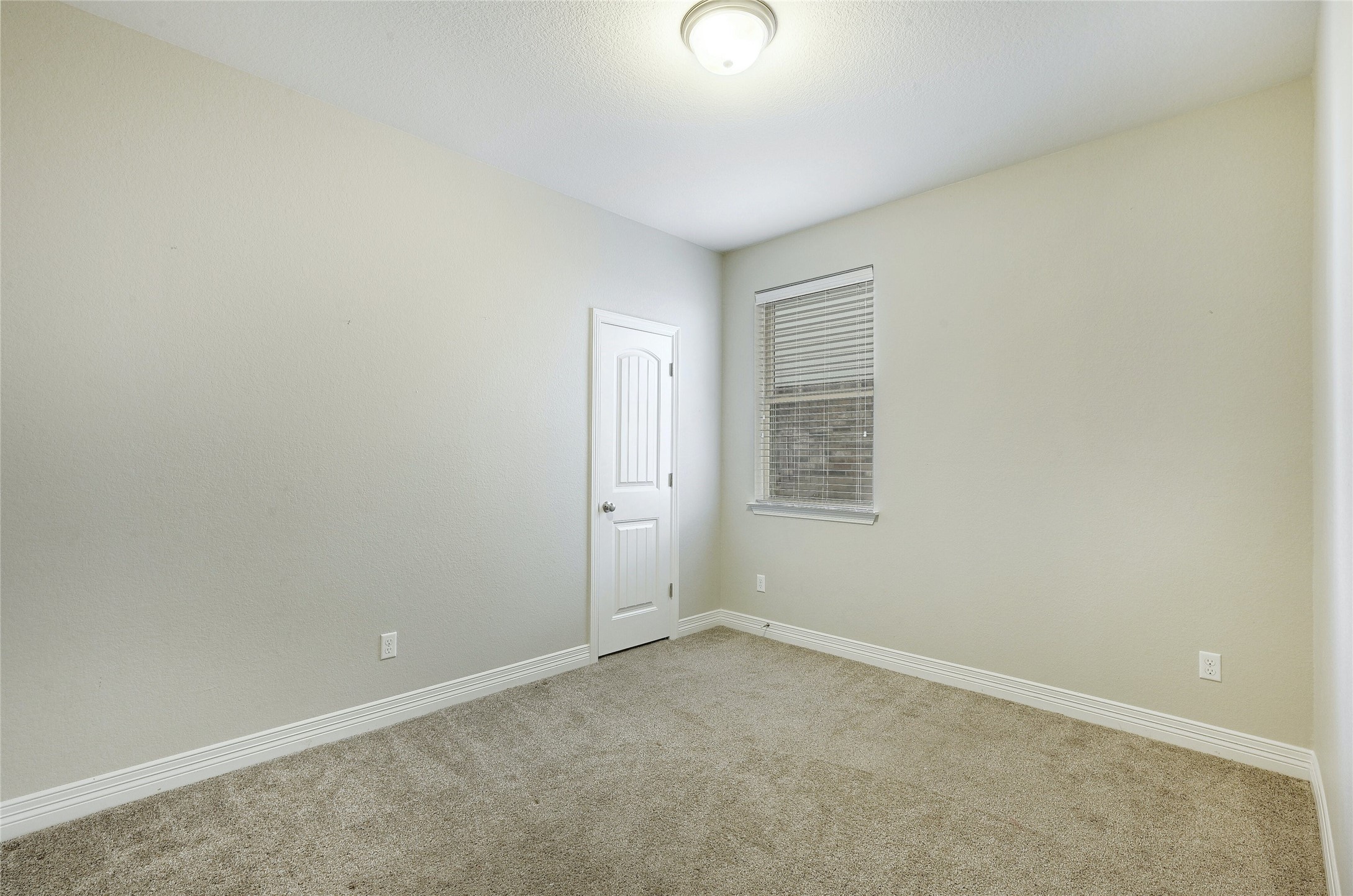 18512 Tanner Bayou Loop Austin, TX 78738 - Photo 17 of 32 an empty room with a window