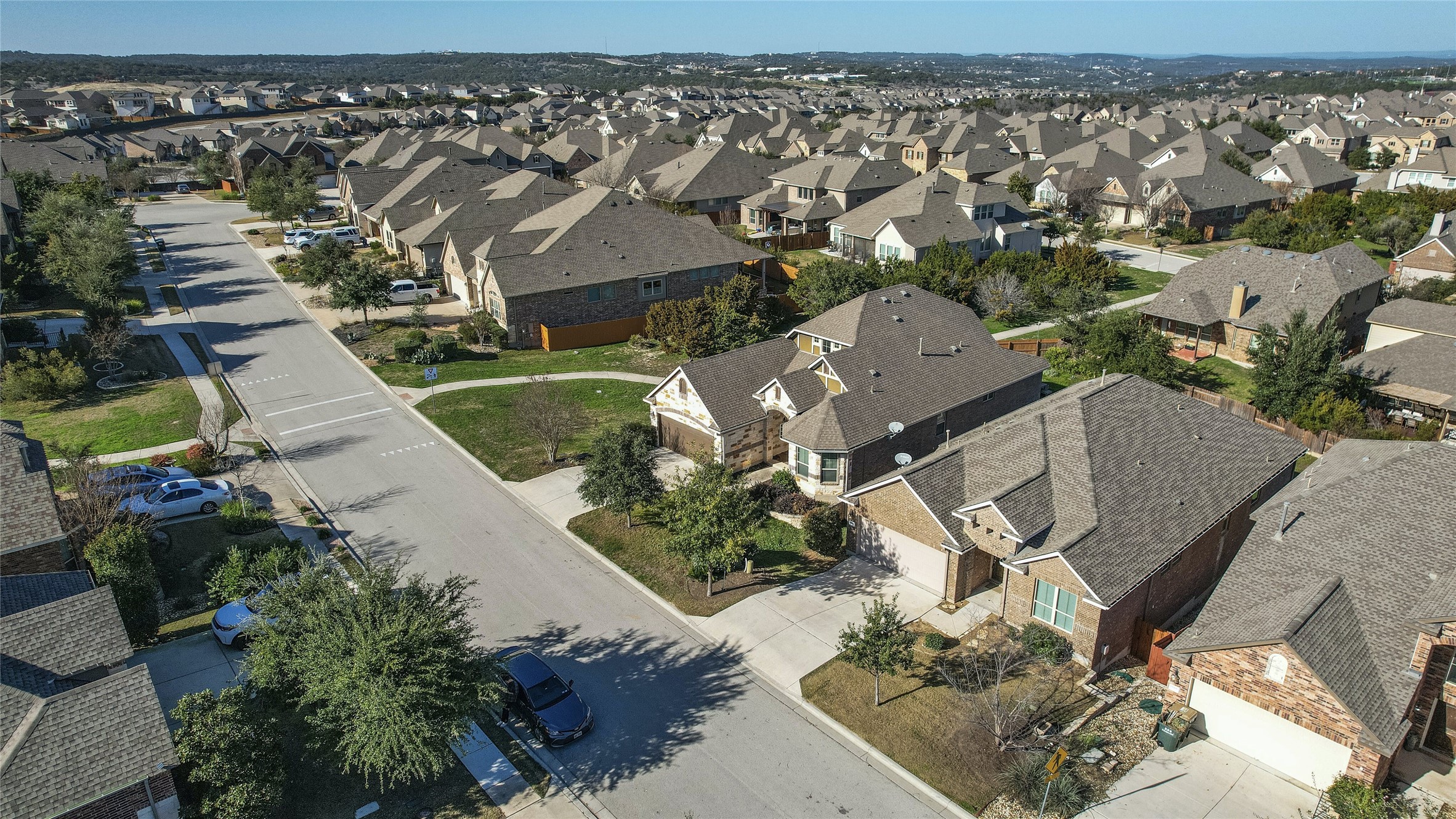 18512 Tanner Bayou Loop Austin, TX 78738 - Photo 23 of 32 an aerial view of a house with a yard