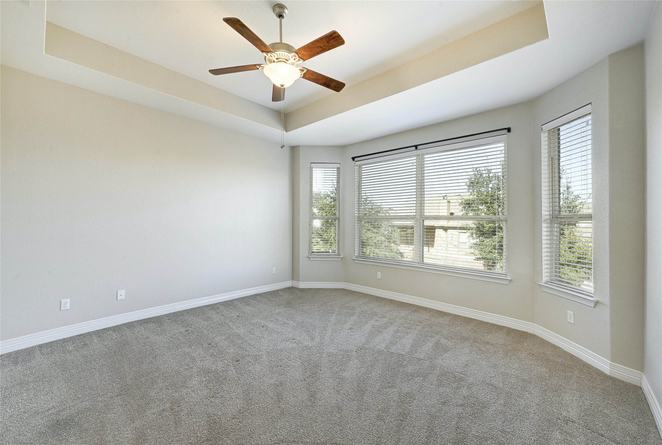18512 Tanner Bayou Loop Austin, TX 78738 - Photo 9 of 32 an empty room with a ceiling fan and window