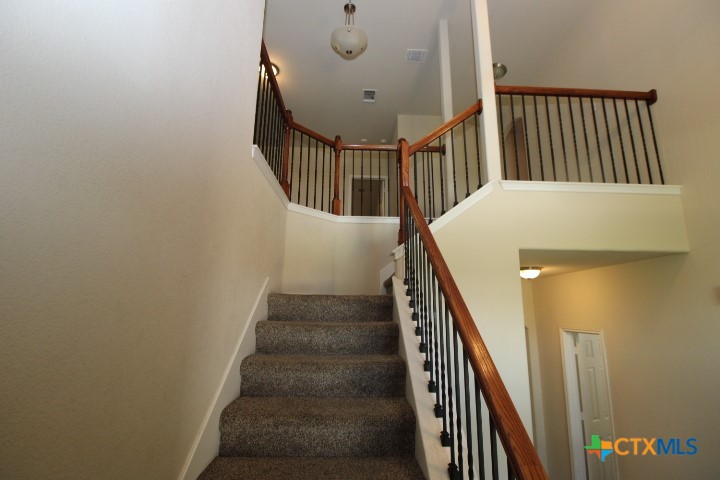 1202 Stonewall Ridge Harker Heights, TX 76548 - Photo 9 of 14 a view of staircase with railing and white walls