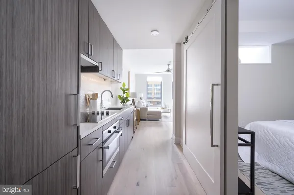 a kitchen with cabinets a sink and appliances