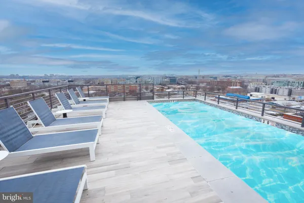 a view of a terrace with wooden floor and city view