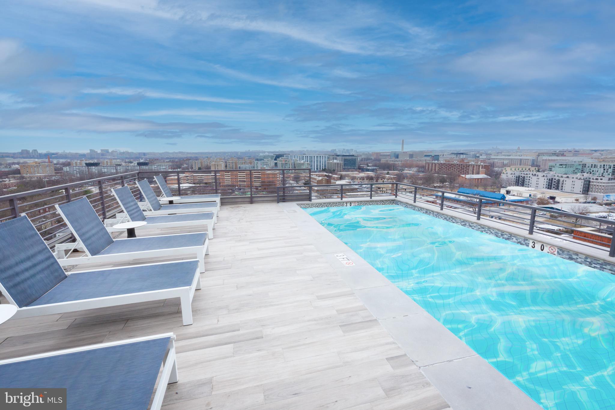 1211 Van Street Southeast, Unit 1010 Washington, DC 20003 - Photo 15 of 19 a view of a terrace with wooden floor and city view
