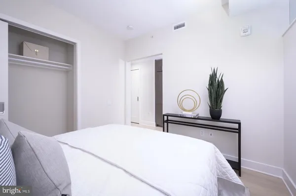 a bedroom with a bed and a closet