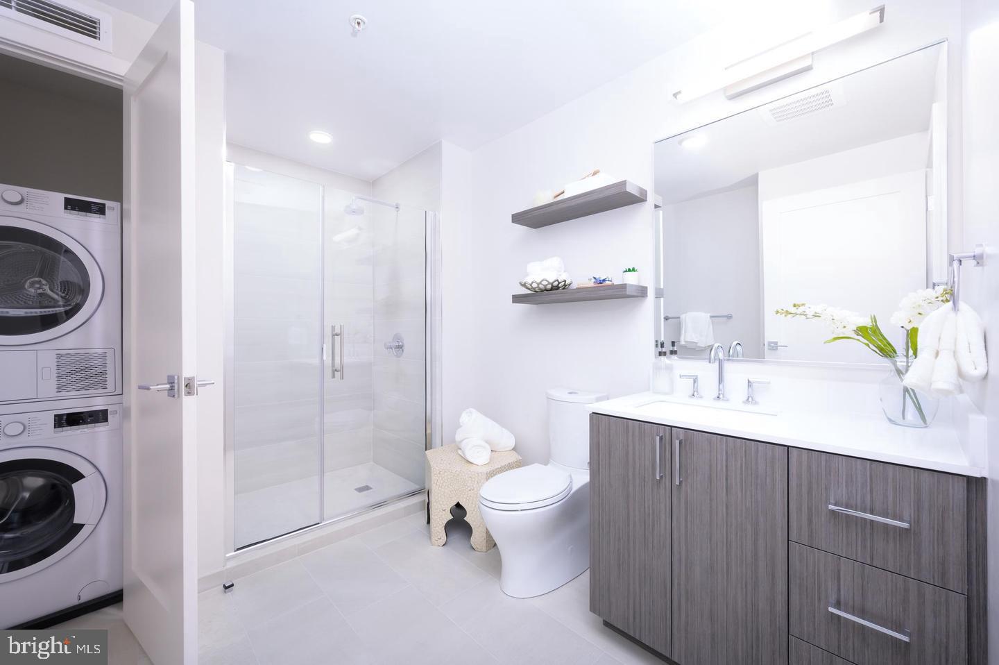 1211 Van Street Southeast, Unit 1010 Washington, DC 20003 - Photo 5 of 19 a spacious bathroom with a sink a toilet and shower