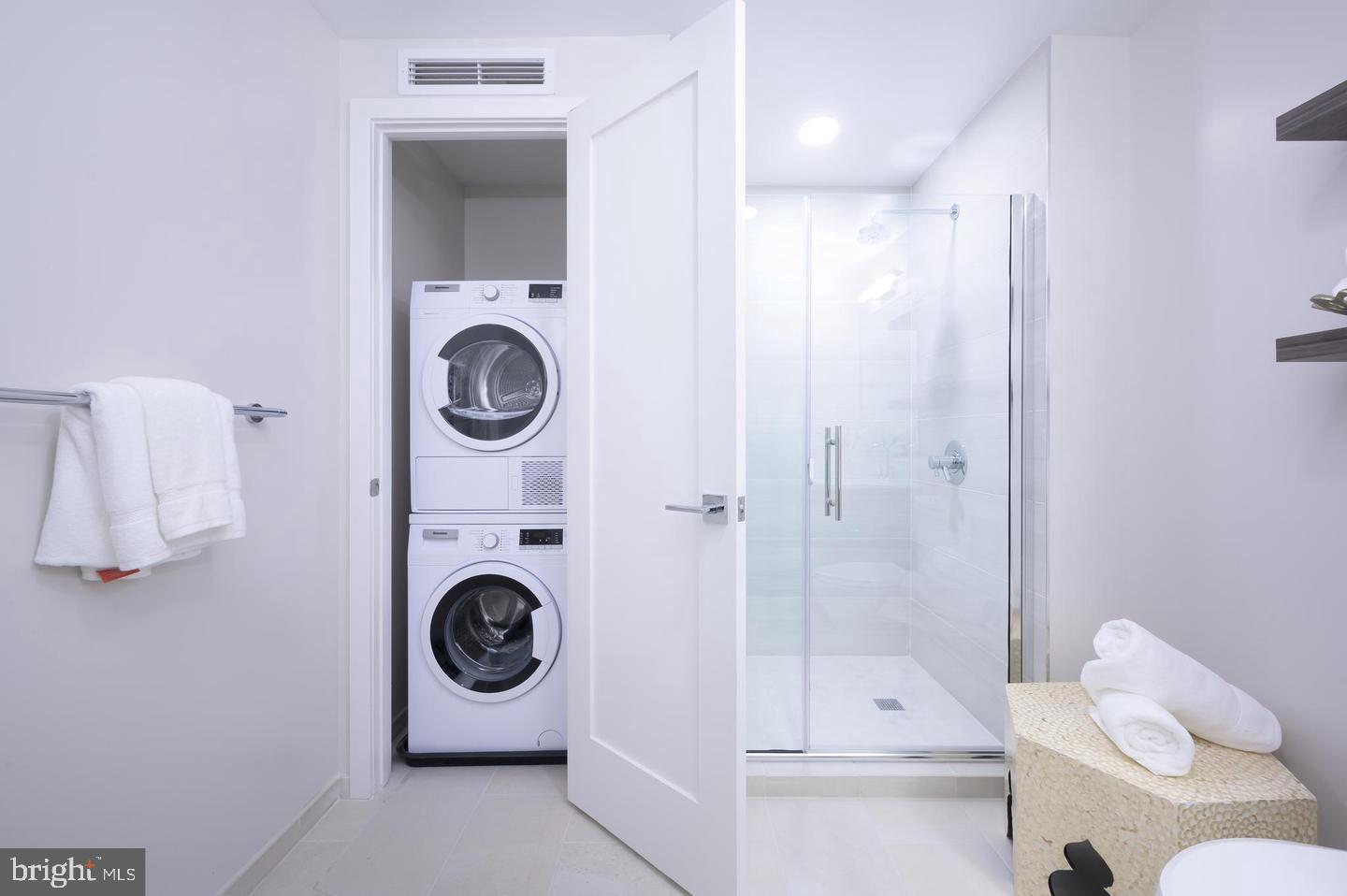1211 Van Street Southeast, Unit 1010 Washington, DC 20003 - Photo 6 of 19 a bathroom with a sink a mirror and tub