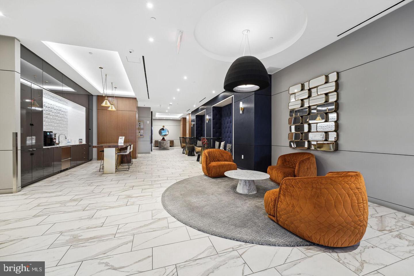 1211 Van Street Southeast, Unit 1010 Washington, DC 20003 - Photo 7 of 19 a living room with furniture and a large mirror