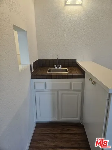 a bathroom with a sink and vanity