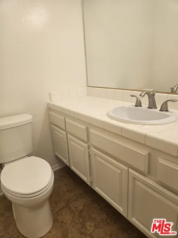 a bathroom with a toilet and a sink