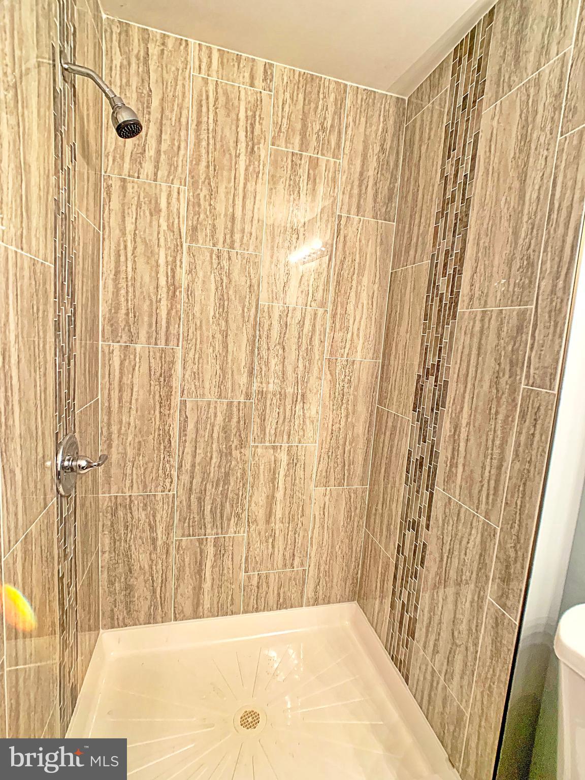 3607 Telmar Road Baltimore, MD 21207 - Photo 11 of 19 a view of a bathroom with shower curtain