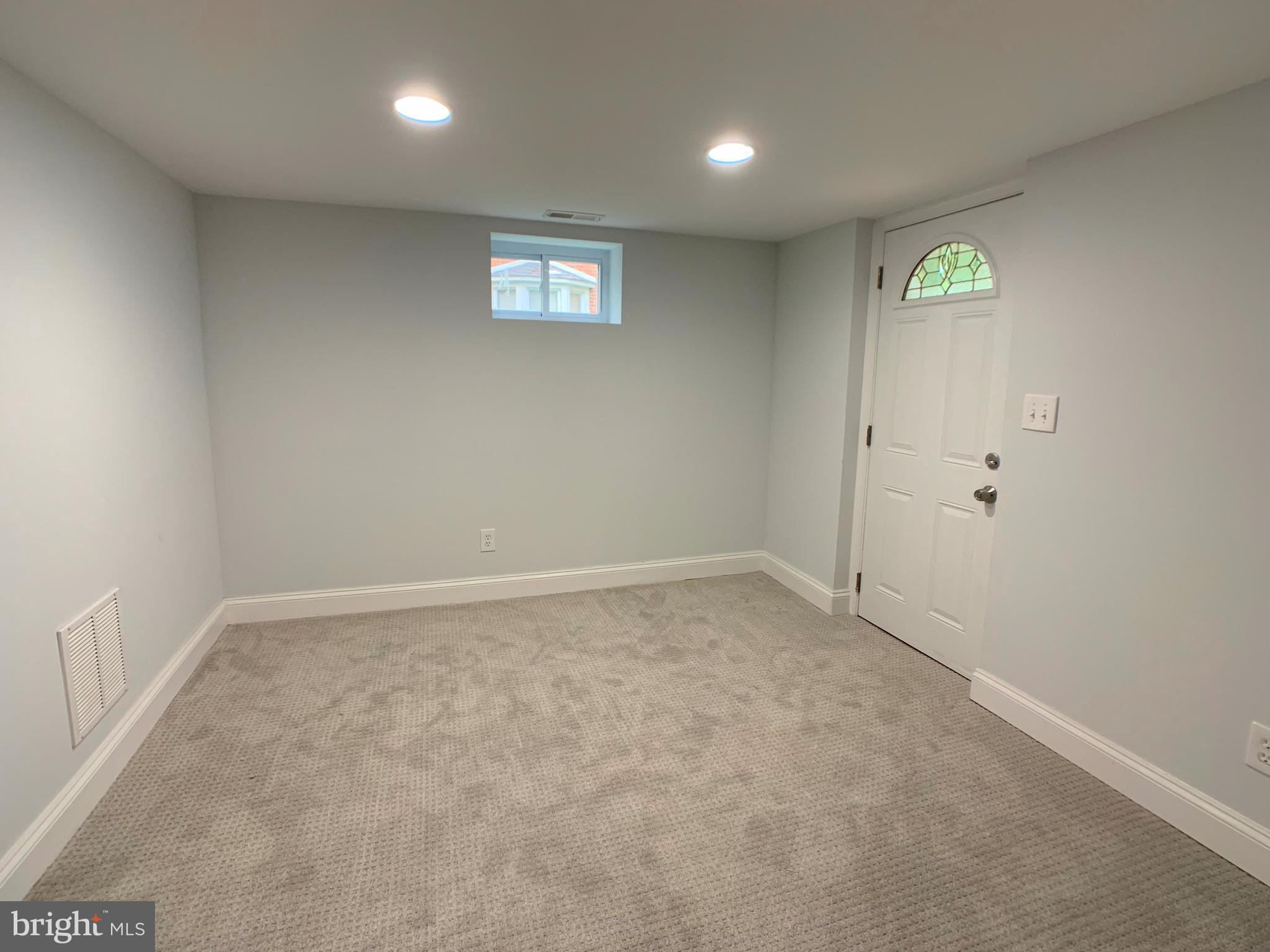 3607 Telmar Road Baltimore, MD 21207 - Photo 12 of 19 an empty room with windows