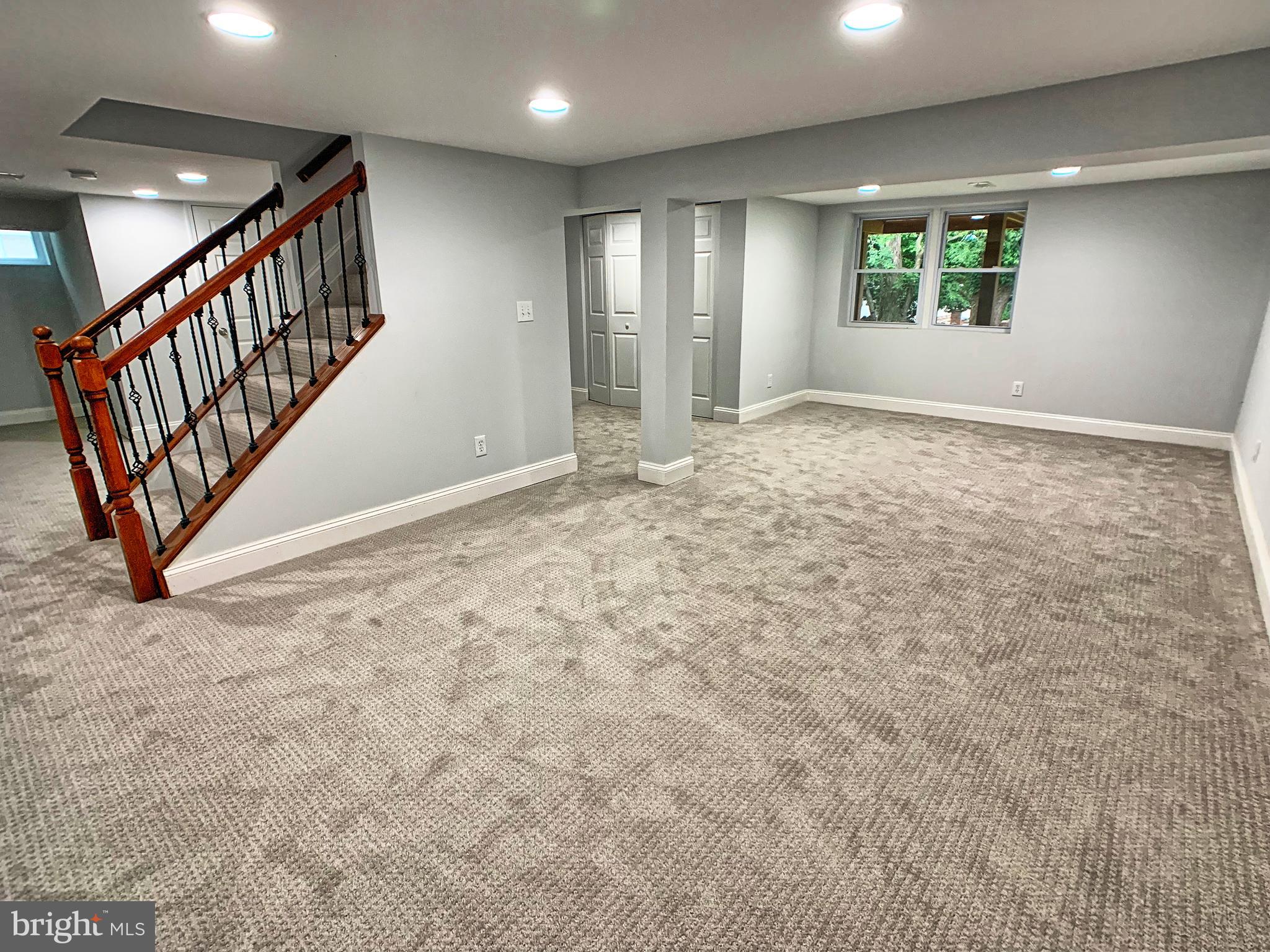 3607 Telmar Road Baltimore, MD 21207 - Photo 14 of 19 a view of an empty room with stairs and a window