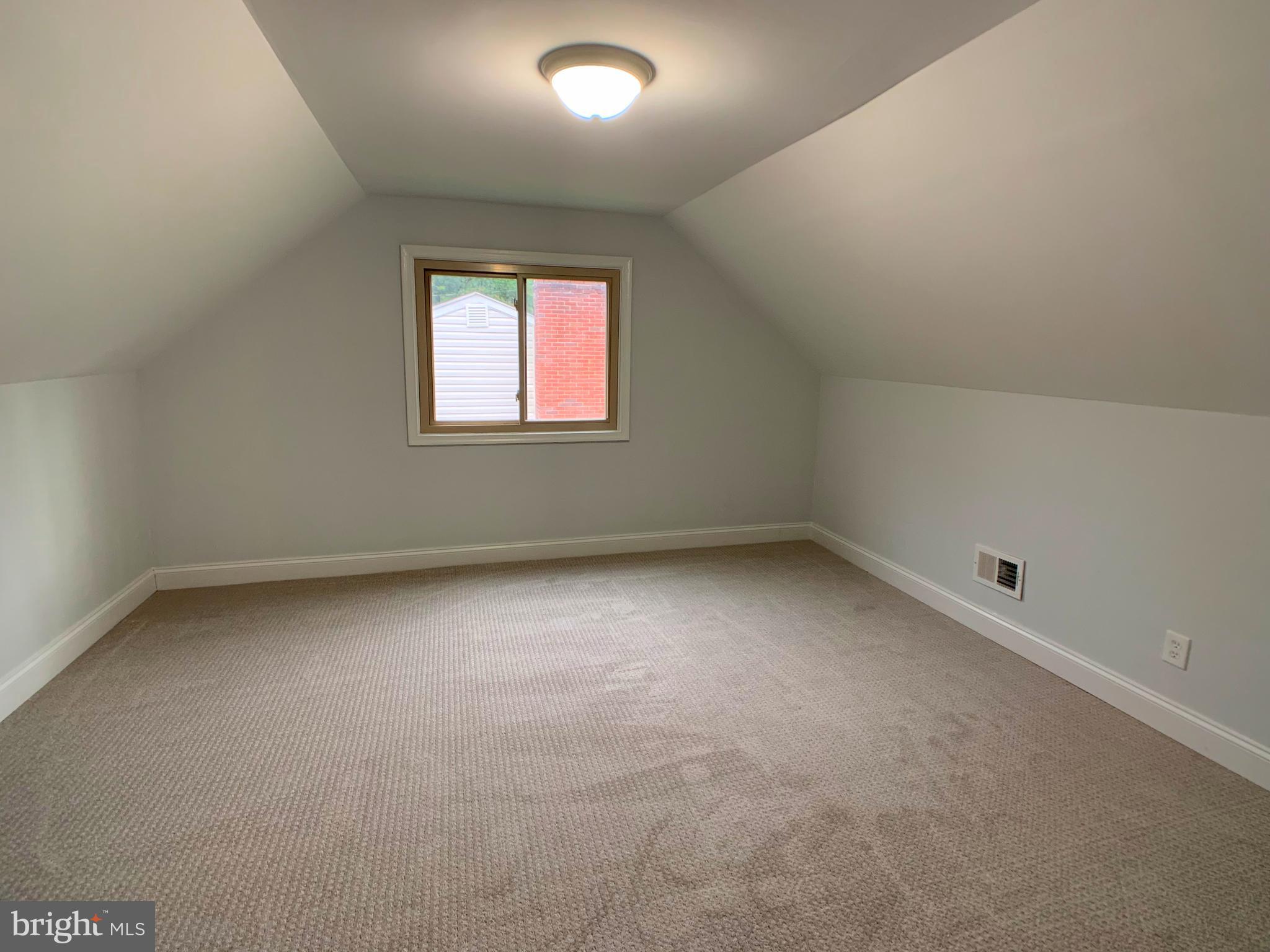 3607 Telmar Road Baltimore, MD 21207 - Photo 15 of 19 an empty room with a window