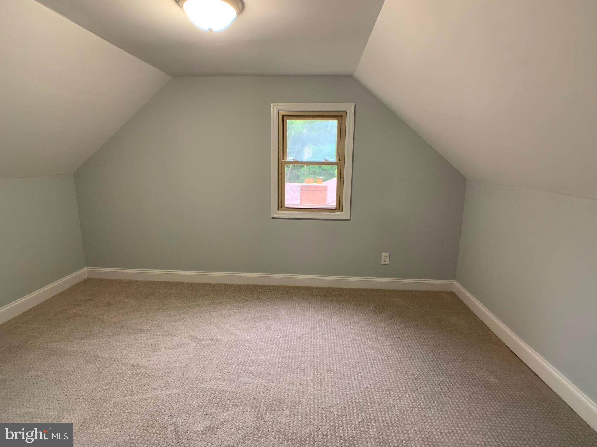 3607 Telmar Road Baltimore, MD 21207 - Photo 16 of 19 an empty room with a window