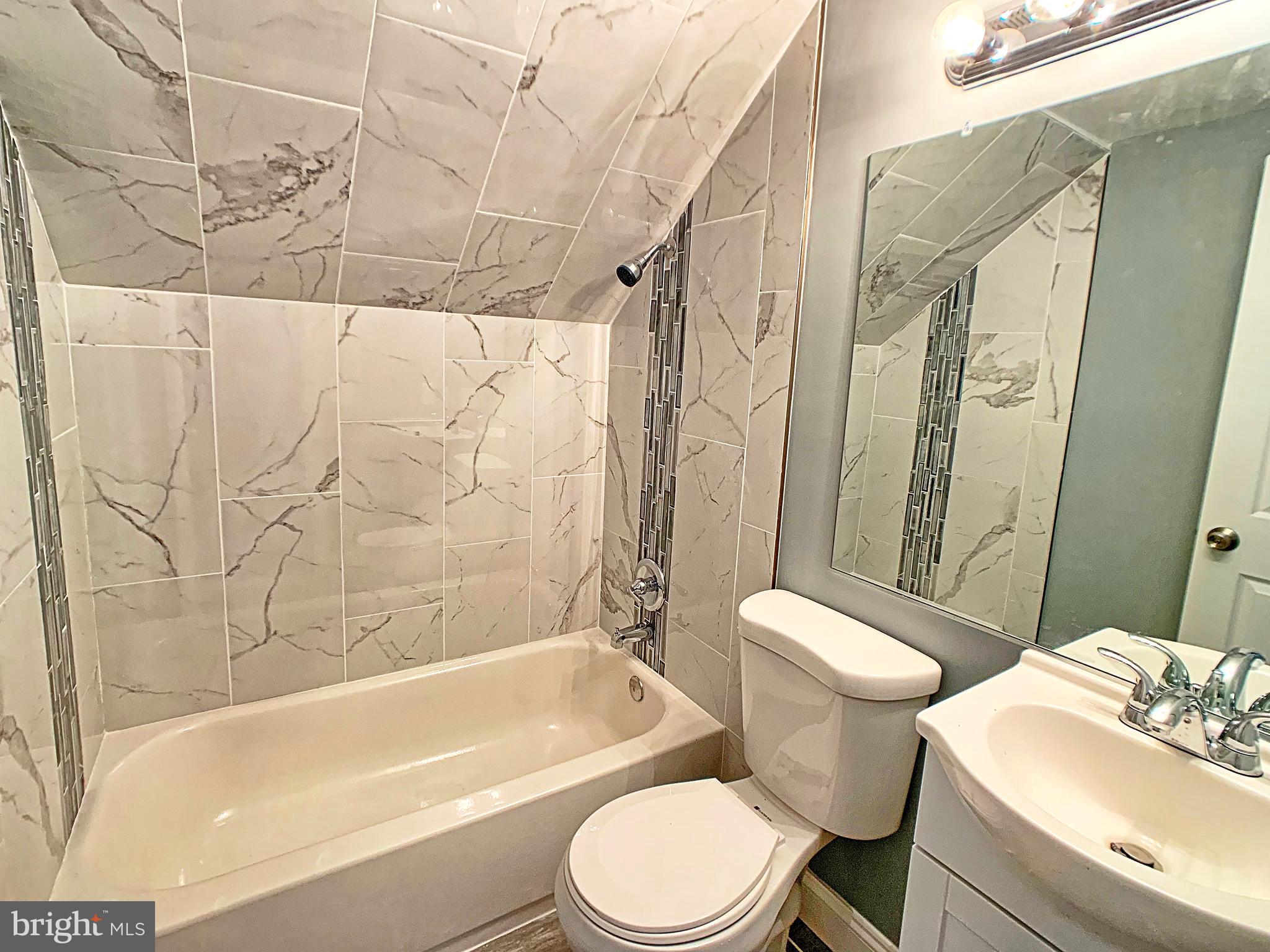 3607 Telmar Road Baltimore, MD 21207 - Photo 17 of 19 a bathroom with a sink toilet and shower