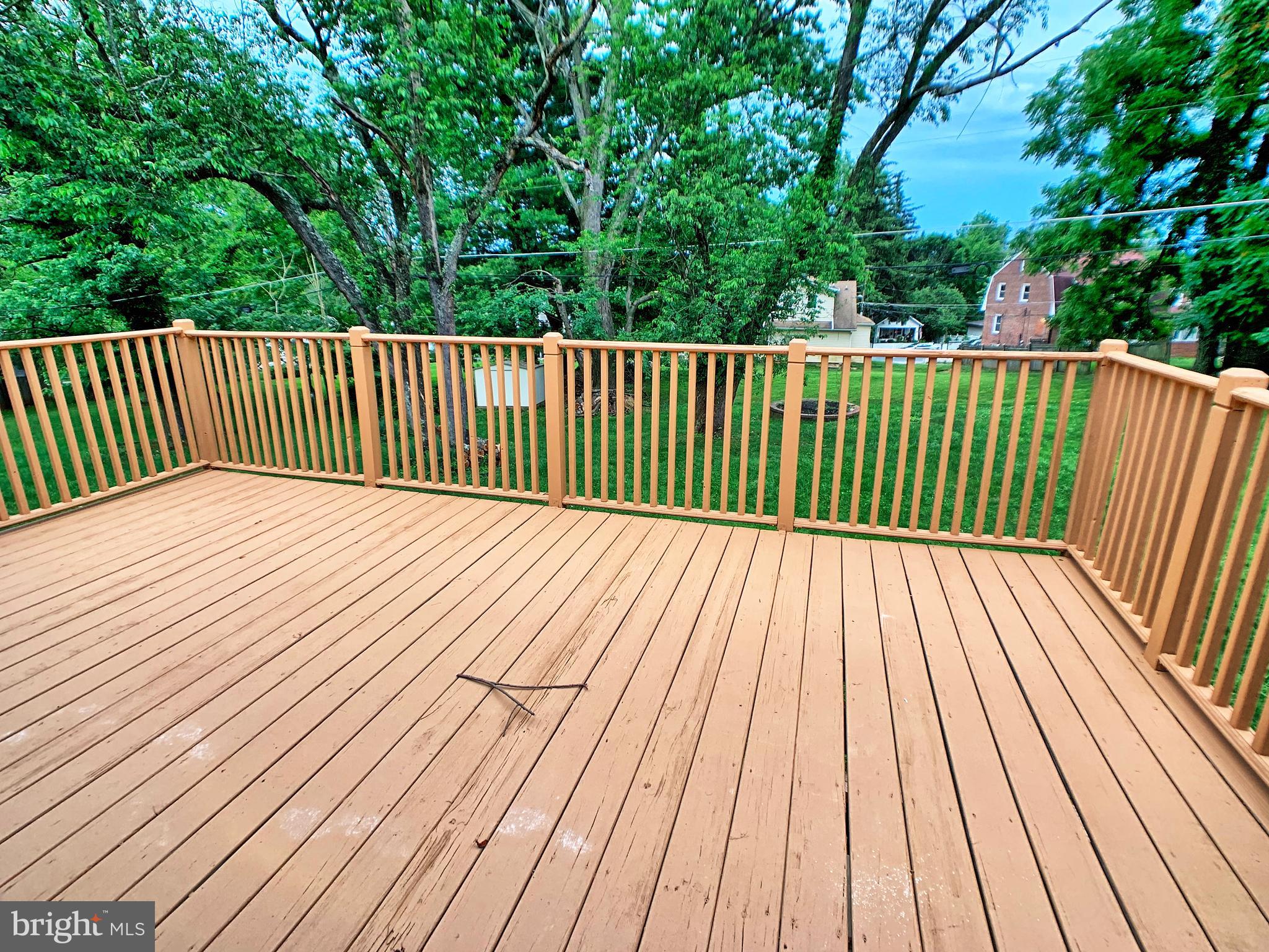 3607 Telmar Road Baltimore, MD 21207 - Photo 18 of 19 a balcony with trees in the background