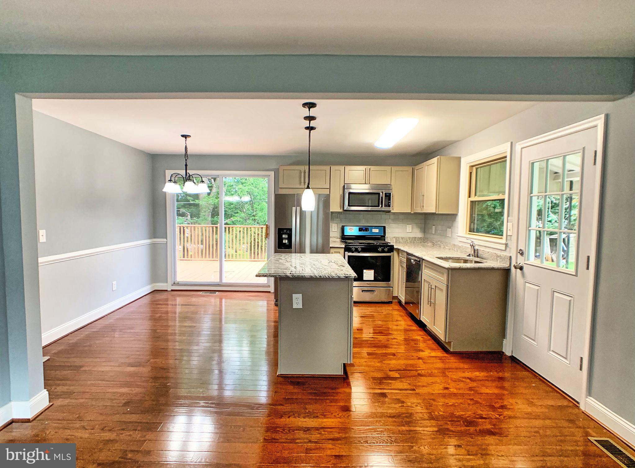 3607 Telmar Road Baltimore, MD 21207 - Photo 4 of 19 a kitchen with counter top space with wooden floor