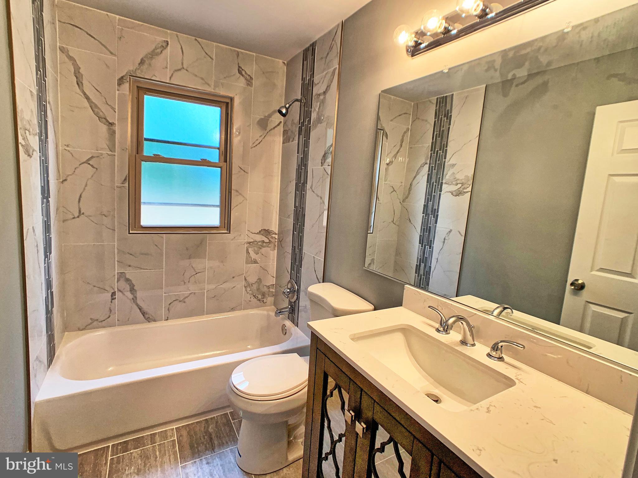 3607 Telmar Road Baltimore, MD 21207 - Photo 7 of 19 a bathroom with a sink toilet and shower