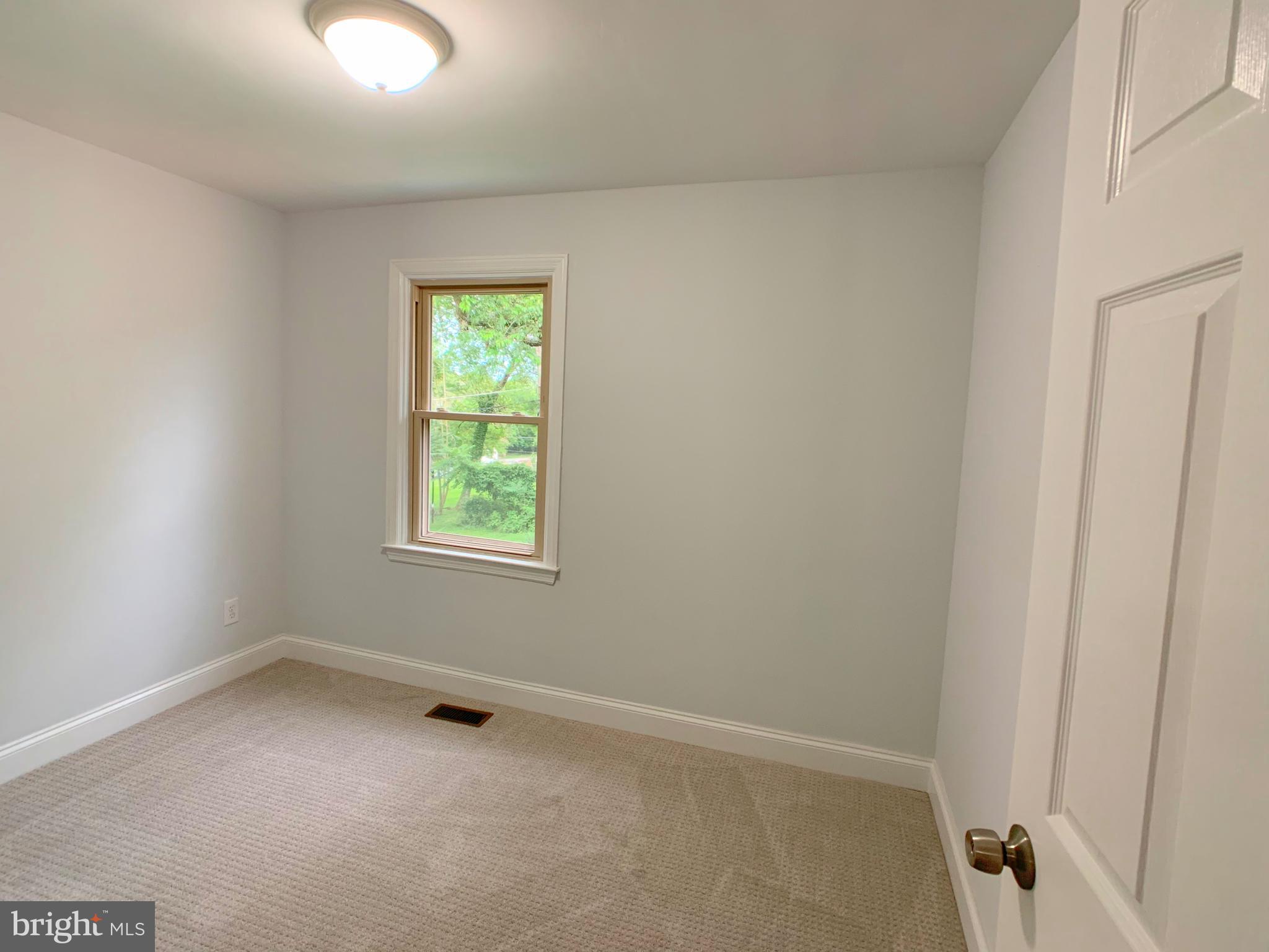 3607 Telmar Road Baltimore, MD 21207 - Photo 8 of 19 an empty room with a window