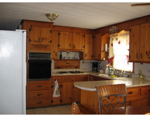 15 Harper Street Springfield, MA 01108 - Photo 2 of 7 a kitchen with stainless steel appliances granite countertop a stove a sink and a refrigerator