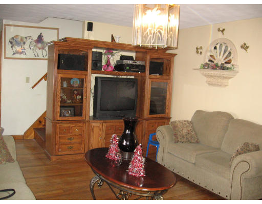 15 Harper Street Springfield, MA 01108 - Photo 3 of 7 a living room with furniture and a flat screen tv