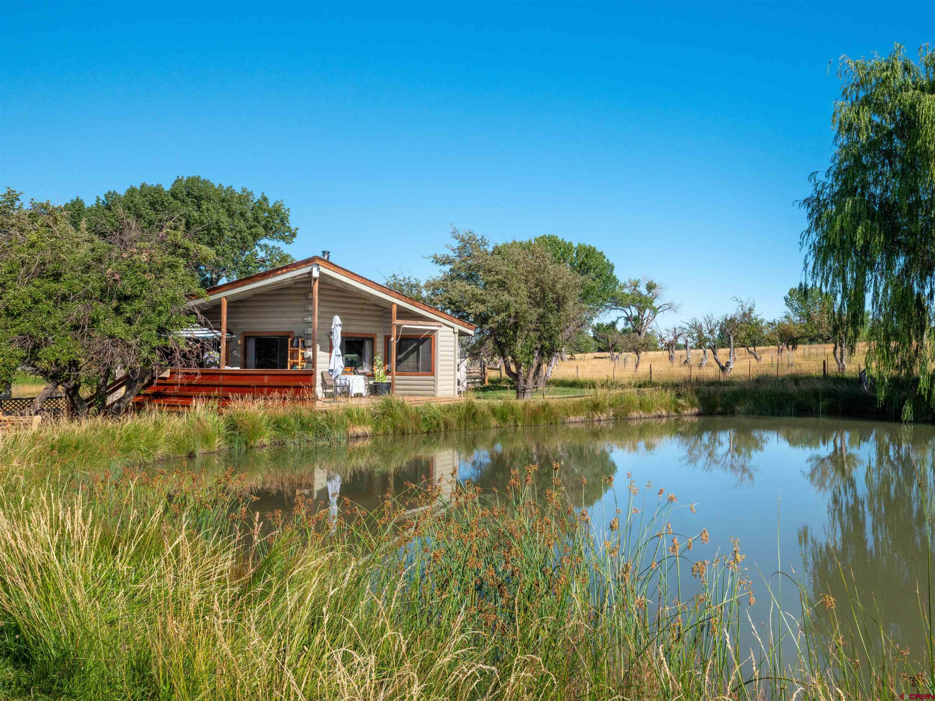 25901 Rd T Dolores, CO 81323 - Photo 1 of 45 a front view of a house with a lake view