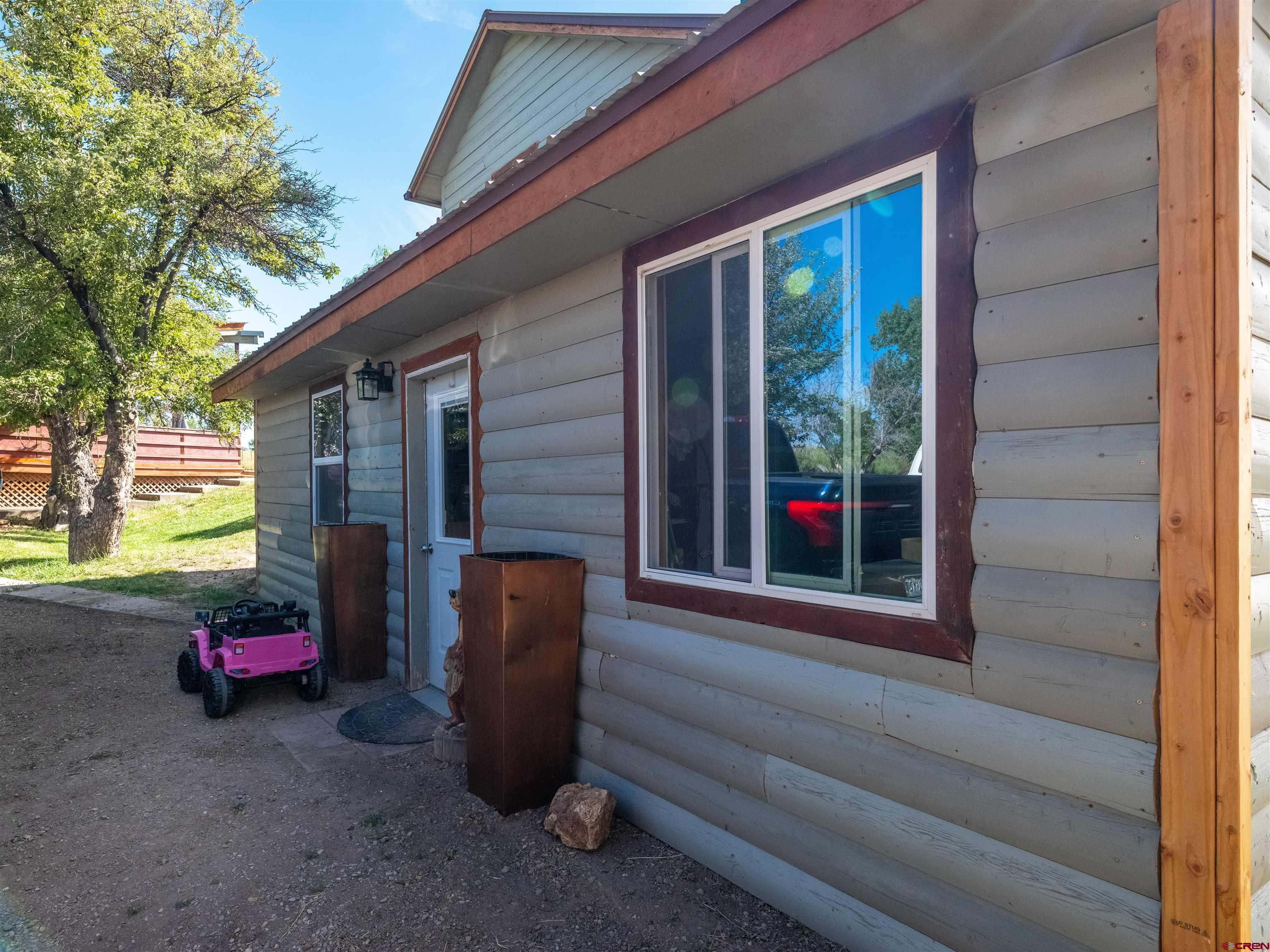 25901 Rd T Dolores, CO 81323 - Photo 14 of 45 a view of a house with a cars park side of a road