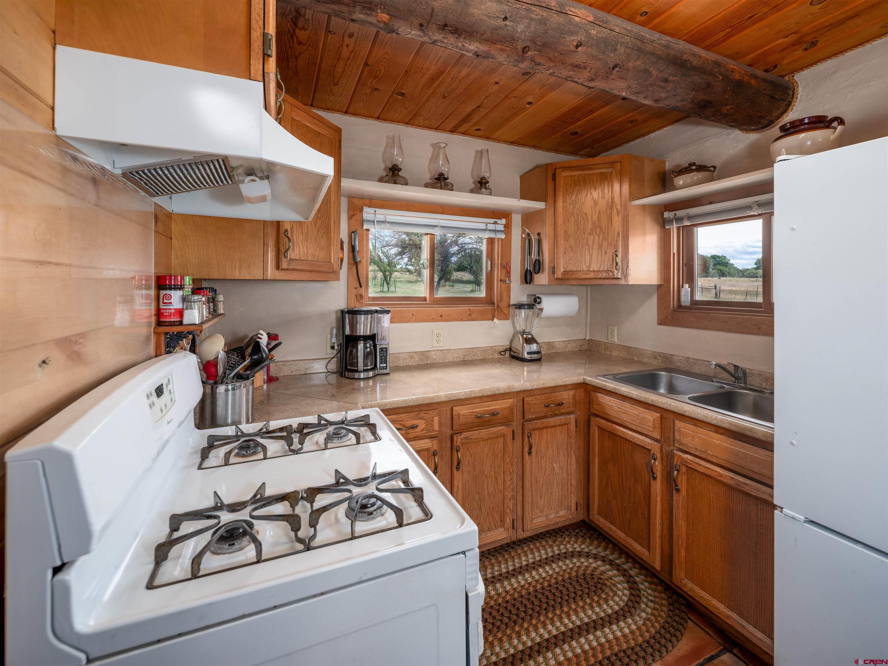 25901 Rd T Dolores, CO 81323 - Photo 15 of 45 a kitchen with a sink stove and cabinets