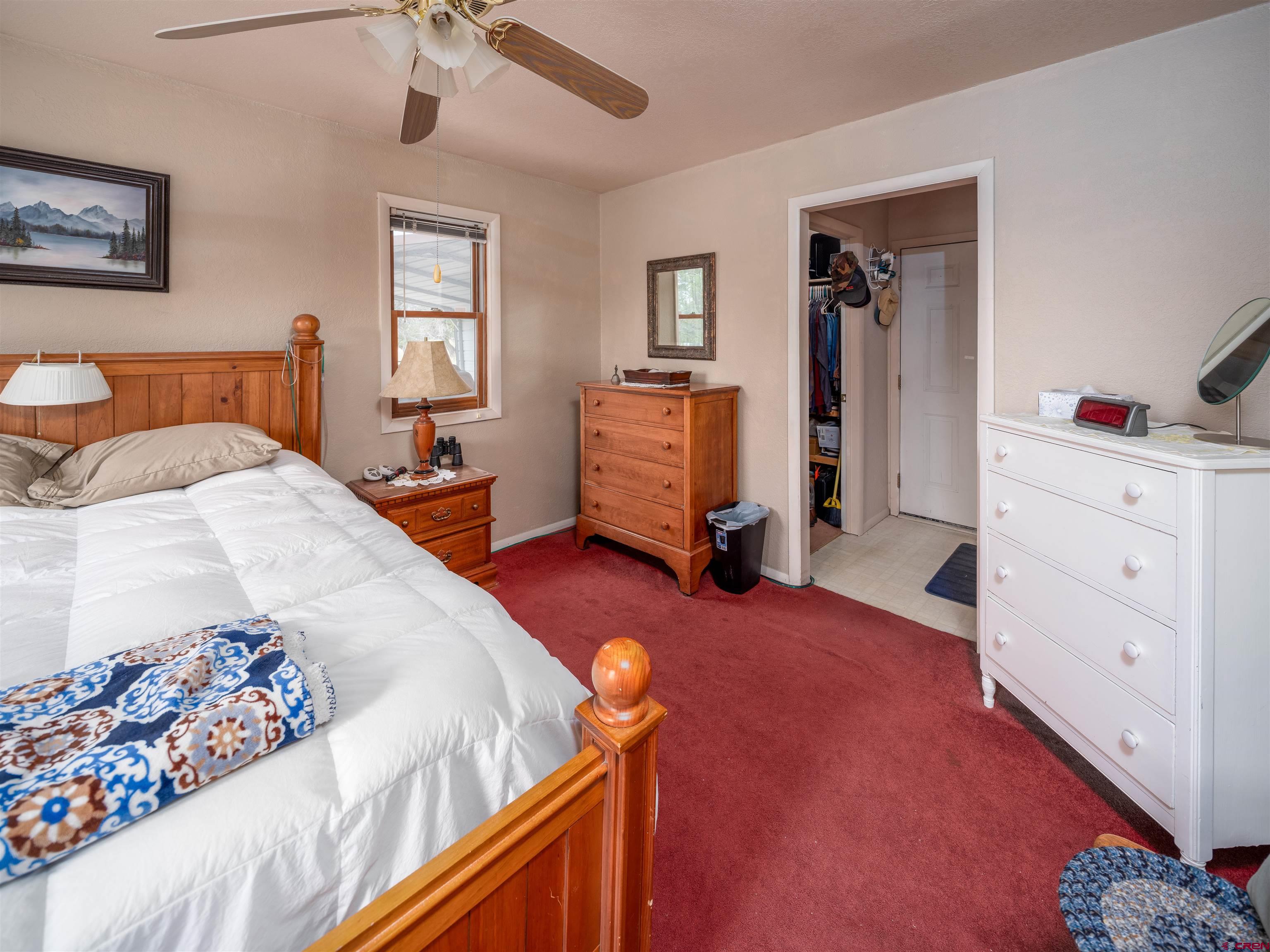 25901 Rd T Dolores, CO 81323 - Photo 17 of 45 a bedroom with a bed and a dresser