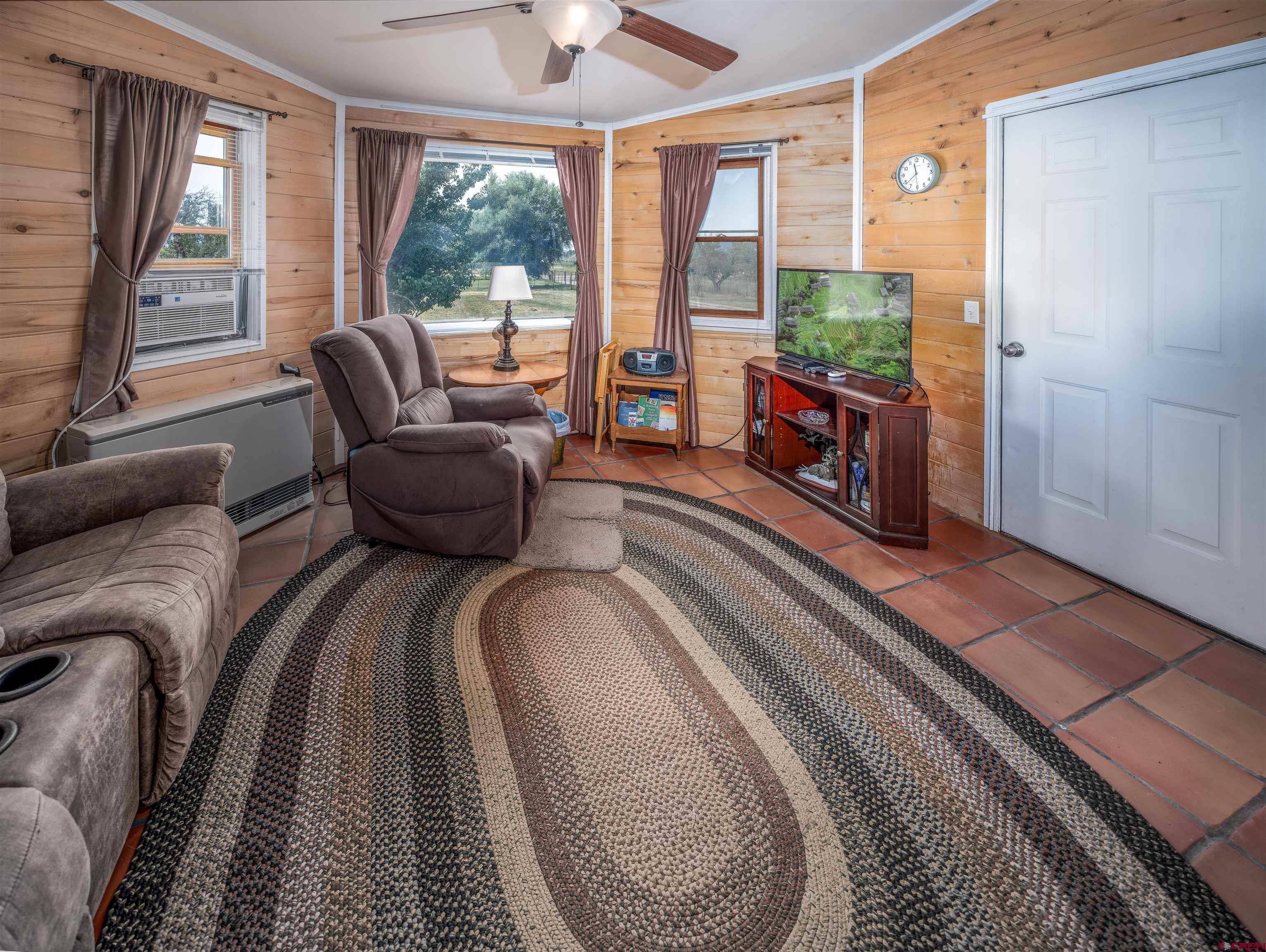 25901 Rd T Dolores, CO 81323 - Photo 19 of 45 a living room with furniture and a large window