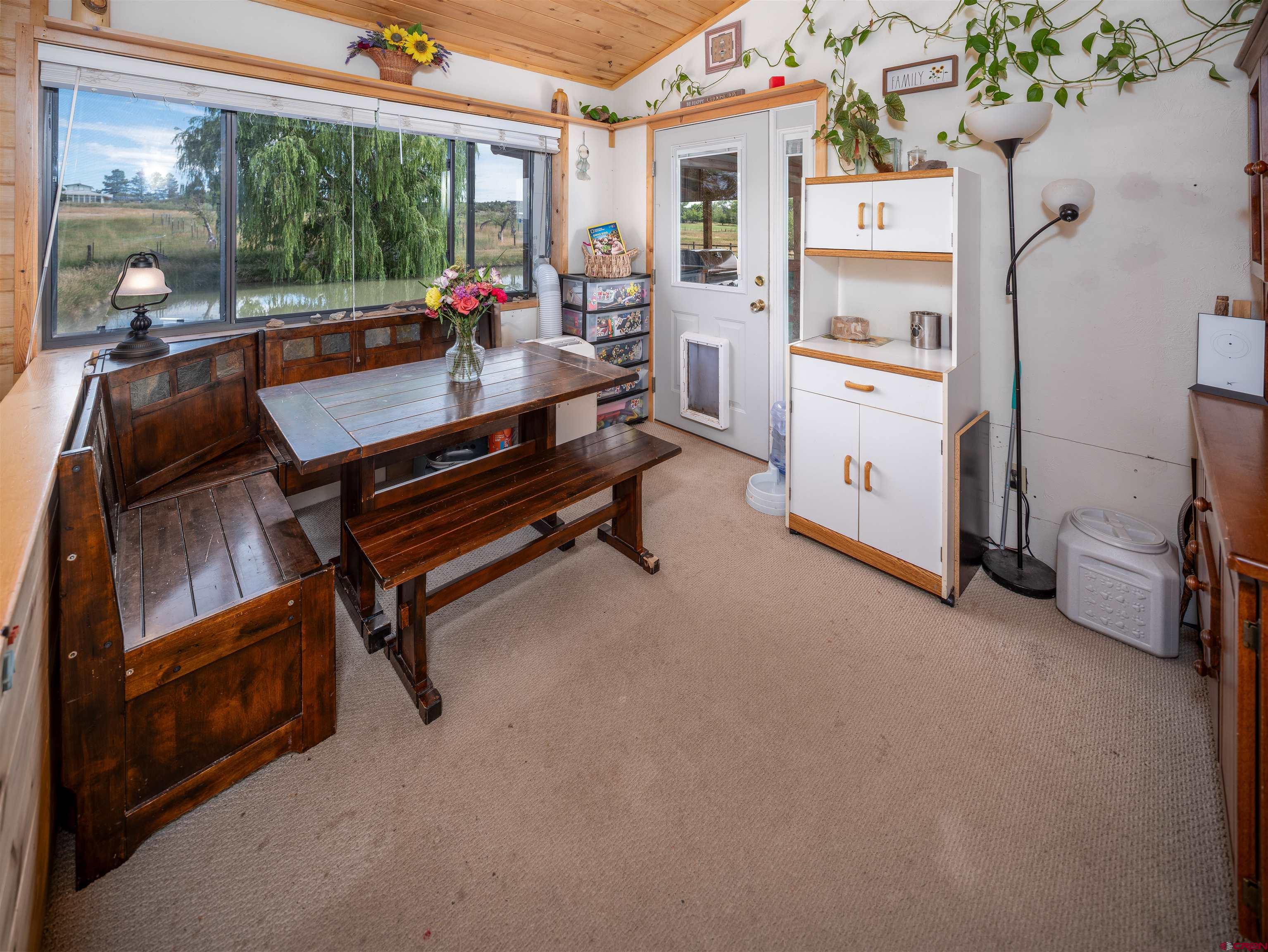 25901 Rd T Dolores, CO 81323 - Photo 28 of 45 a room with patio furniture and a floor to ceiling window