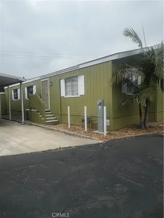 a view of a house with a yard and garage