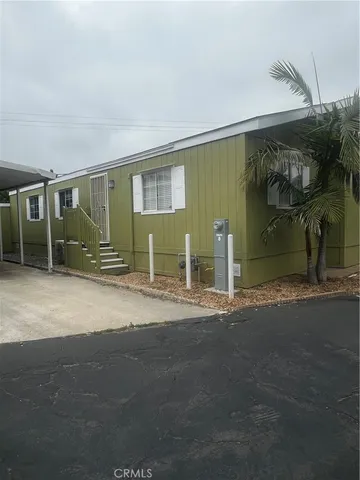 a view of a house with a yard and garage
