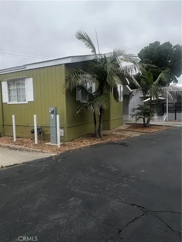 a view of a house with a yard and garage