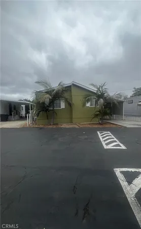 a view of building with car parked