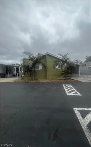 a view of building with car parked
