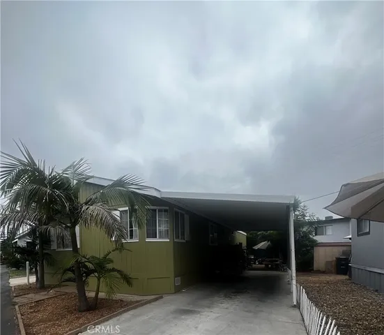 a view of backyard with sitting area