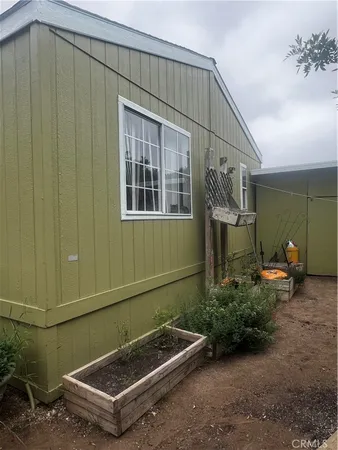 a backyard of a house with chairs
