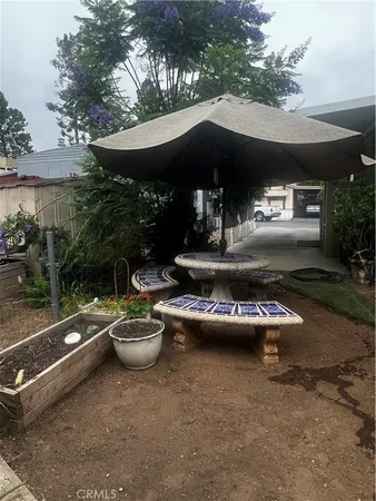 a view of a patio with chairs and tables
