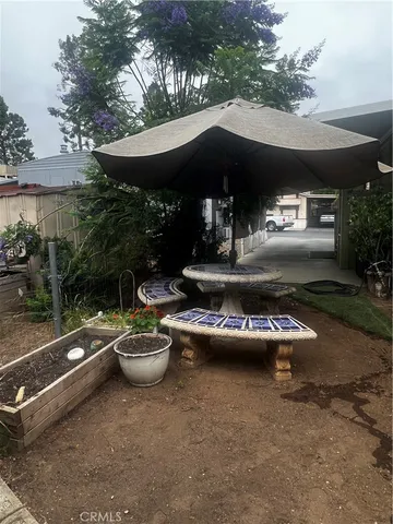 a view of a patio with chairs and tables