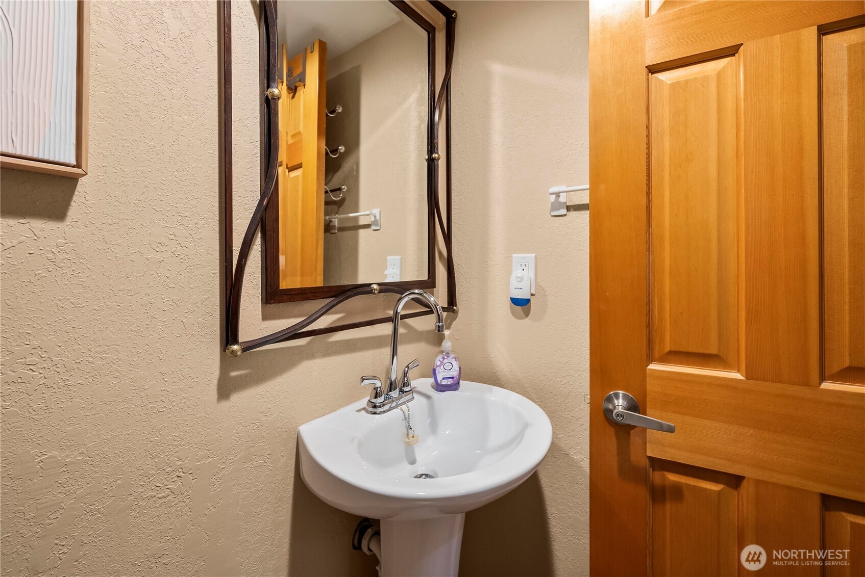 1546 Reservation Road Southeast, Unit 149 Olympia, WA 98513 - Photo 14 of 38 a bathroom with a sink and a mirror
